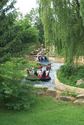 A white-water raft ride for the whole family, riders on Raging Rapids are warned, "You will get wet!"